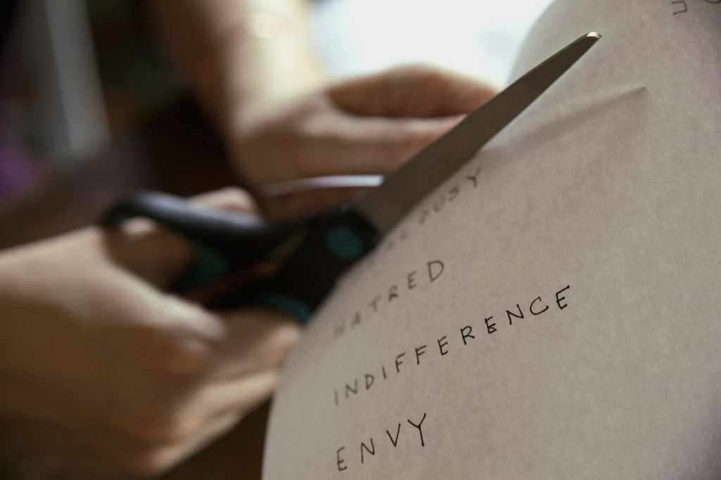 a therapist cutting paper during a cognitive therapy exercise