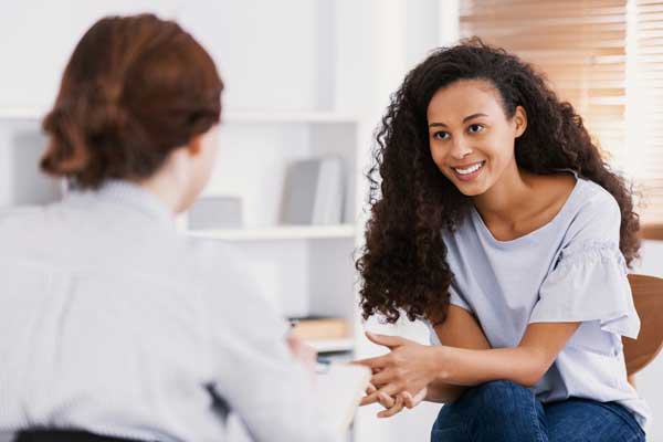 two women in mental health therapy conversation at Luminspire Counseling