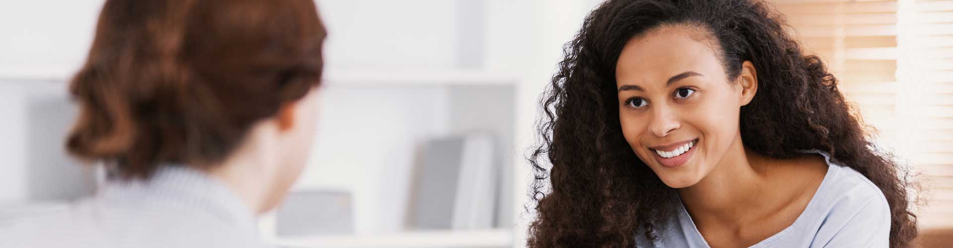 a therapist observing a patient's facial expression during a counseling session