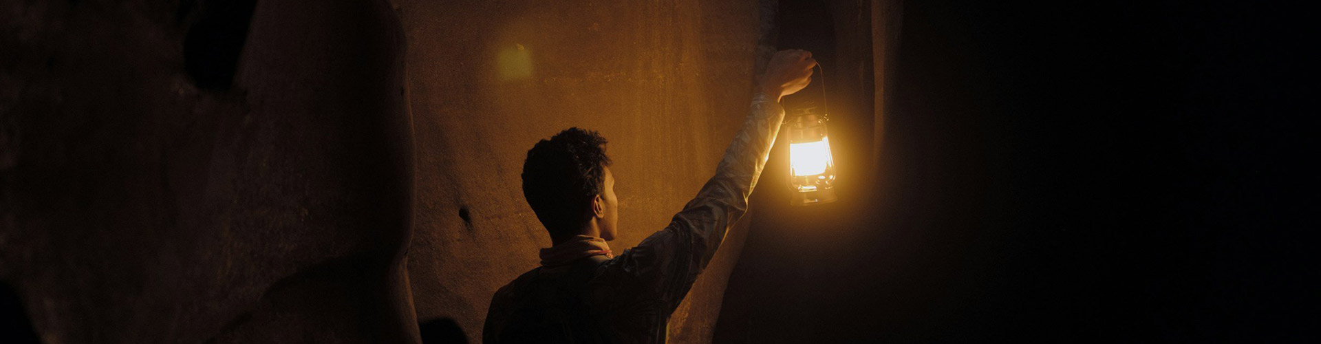 a person standing in a gently lit room during a session in West Palm Beach