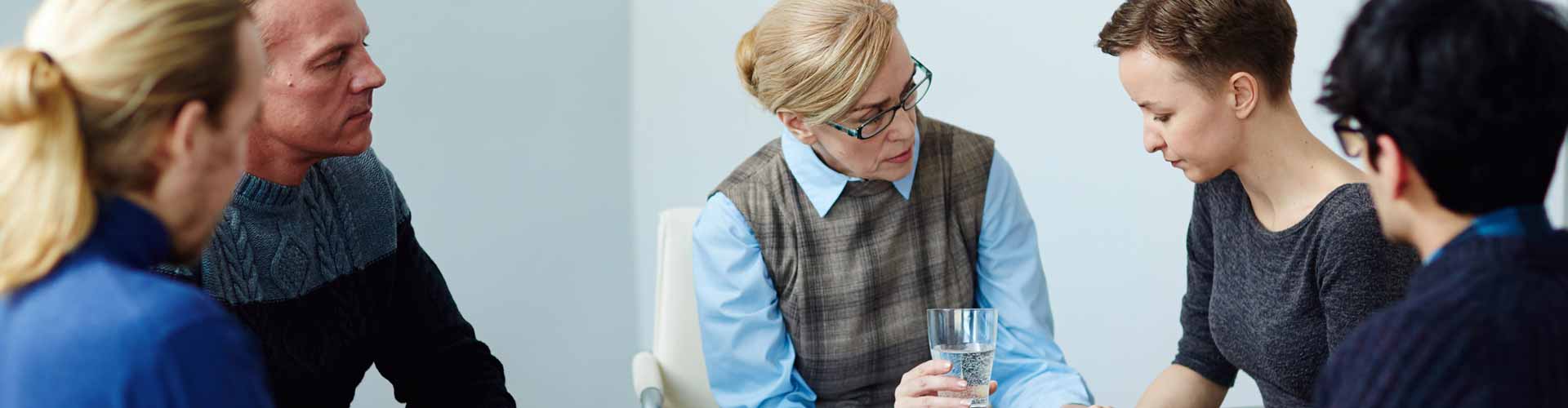 a couple reviewing family therapy results with a therapist in South Florida